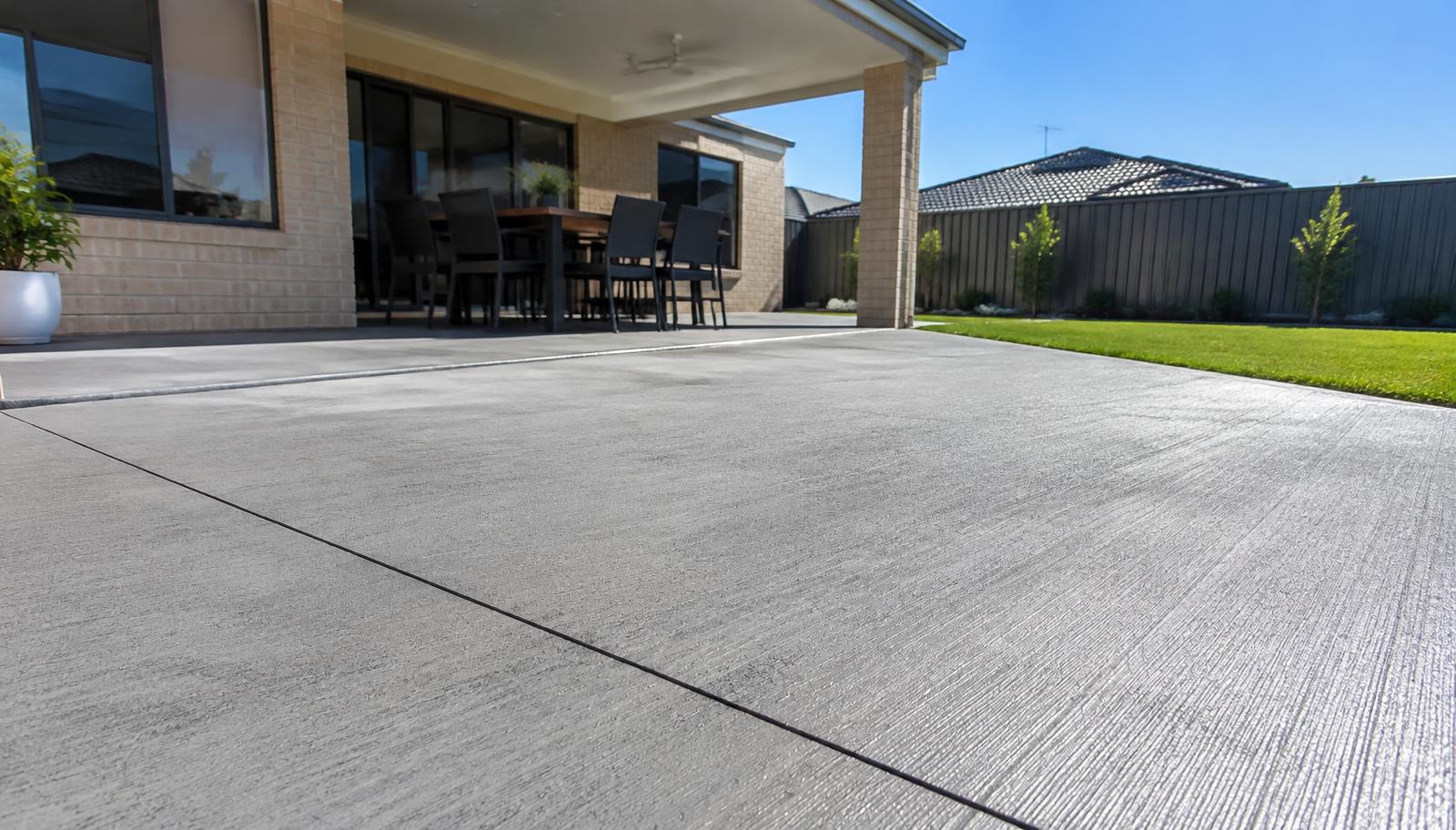 Broom finish concrete patio extending from an undercover alfresco area in Baldivis